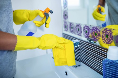 Technician performing sofa cleaning service in Dagenham