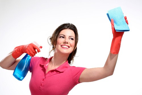 Deep mattress cleaning equipment in use on a bed